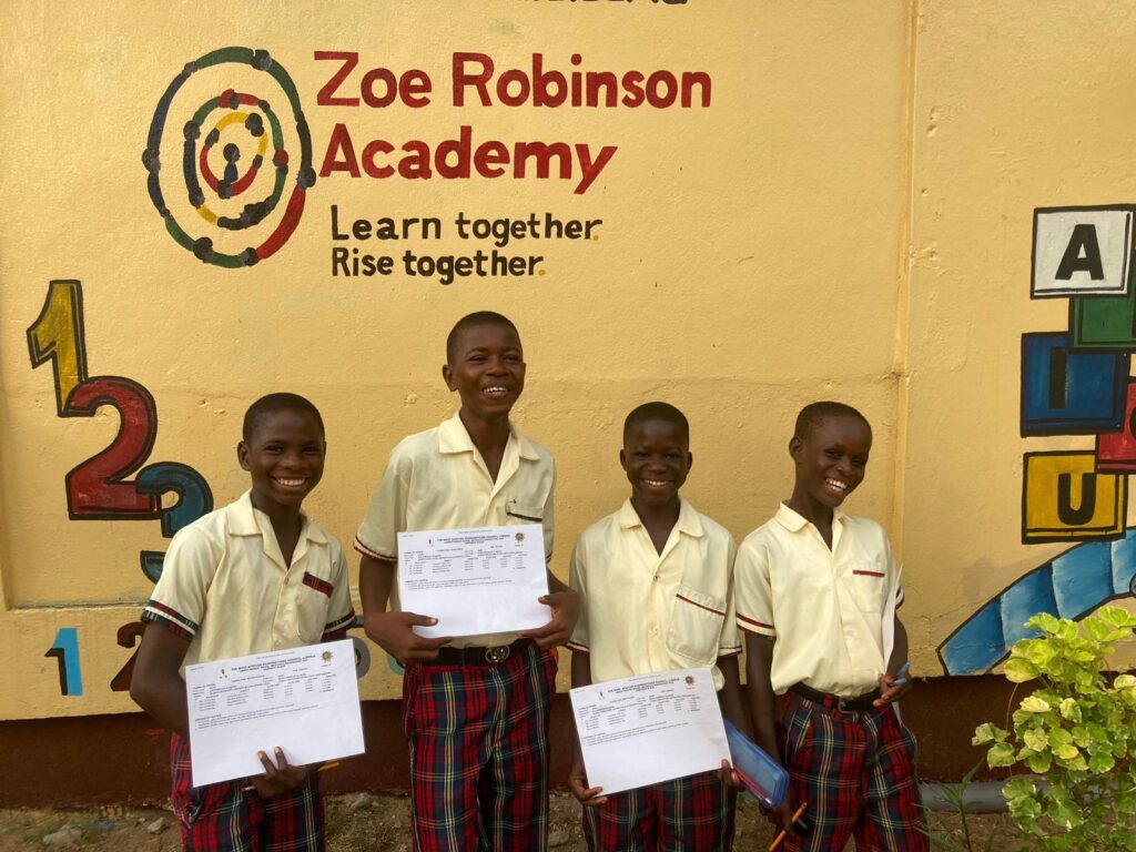 Students at Zoe Robinson Academy celebrating their milestone after sitting for national examinations in Liberia.